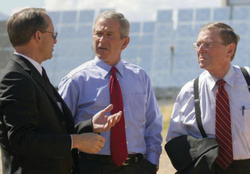Senator Domenici and President Bush talk with Thomas Hunter of Sandia National Laboratory during a tour of the Lab's National Solar Thermal Test Facility in August 2005.